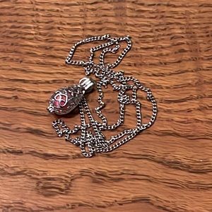 Essential oil necklace + extra cotton balls.